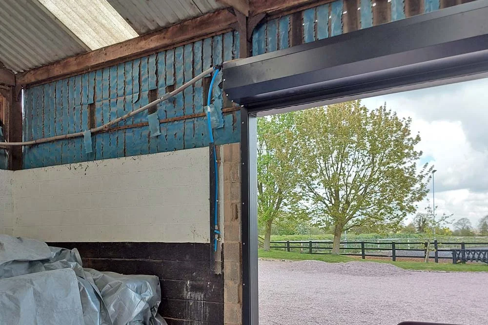 Barn interior with roller door fitted
