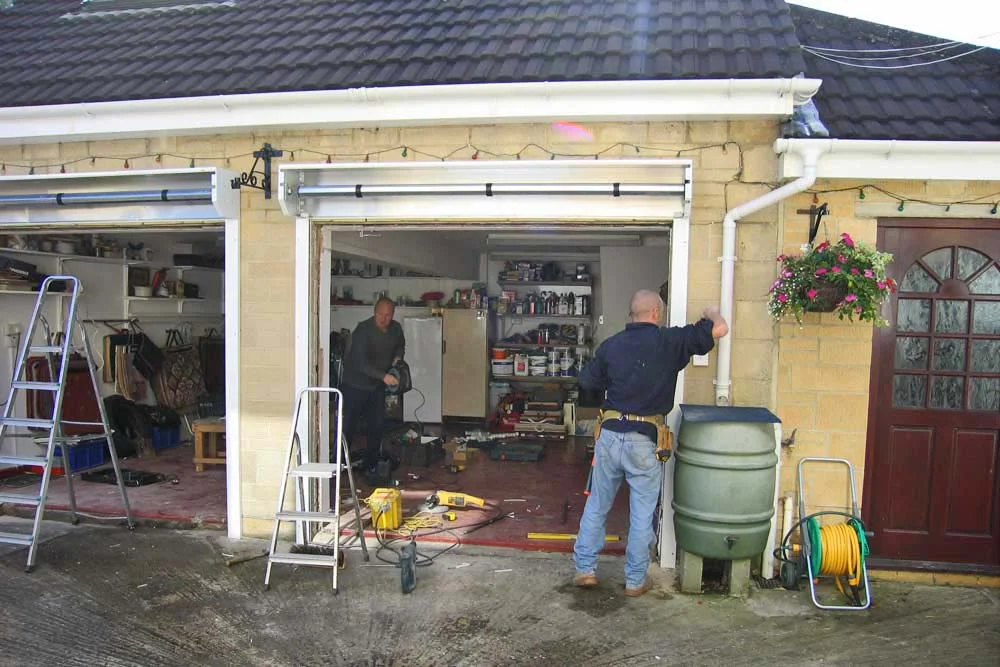 Team installing a roller garage door